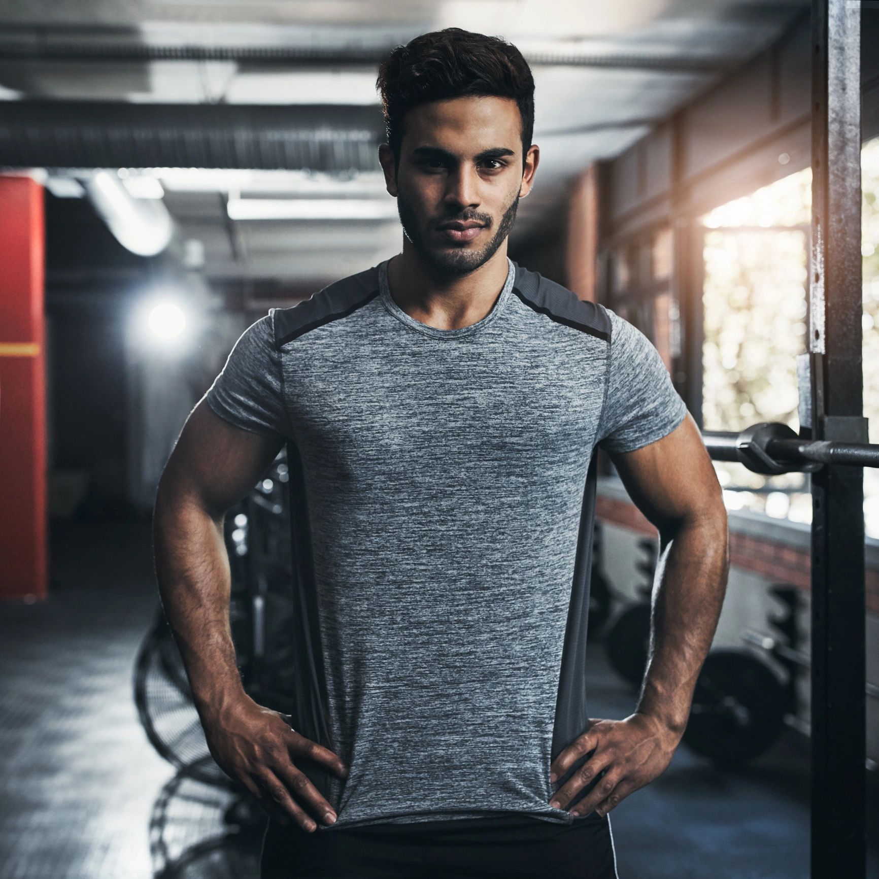 Portrait of a male fitness trainer in a gym
