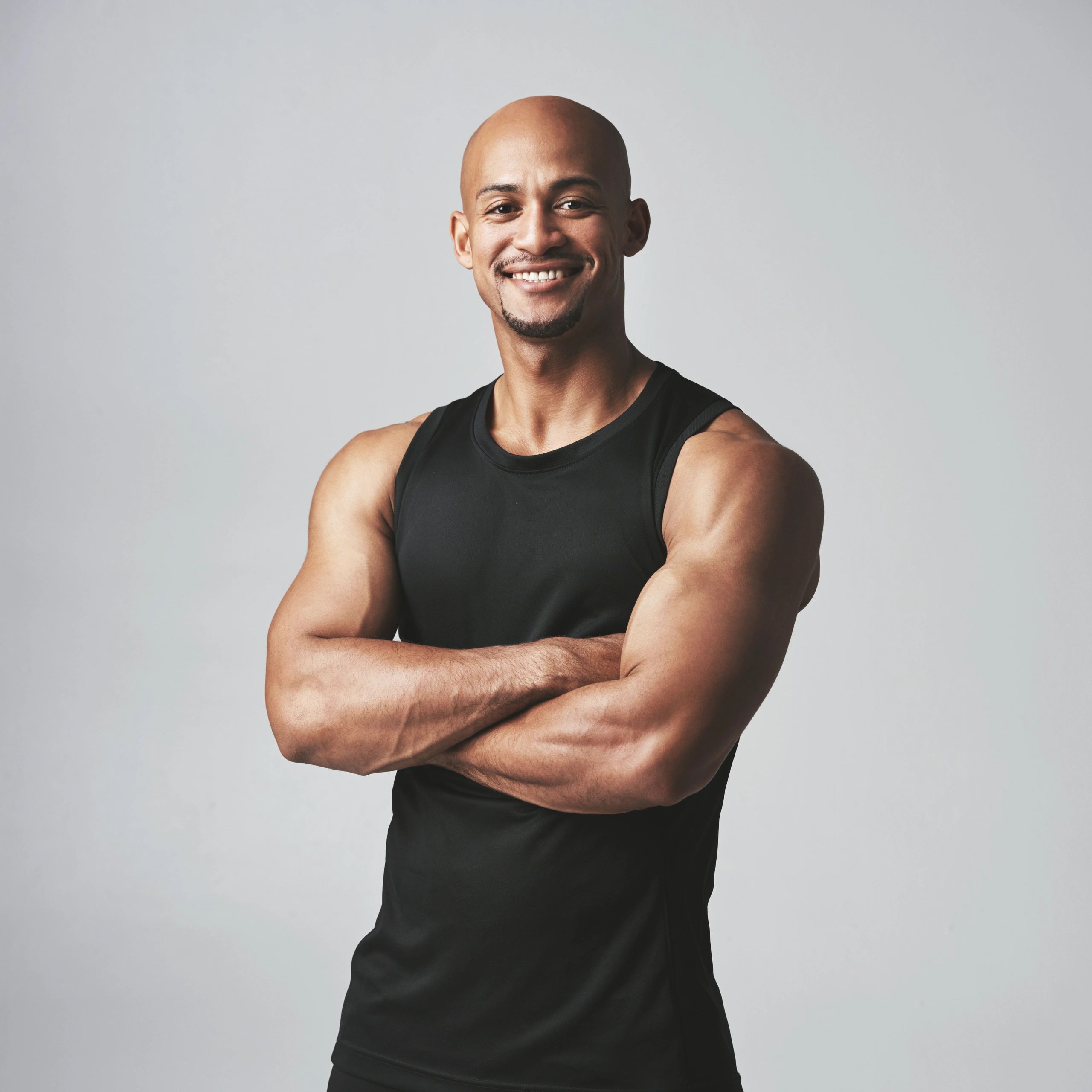 Portrait of a male athlete against a neutral background