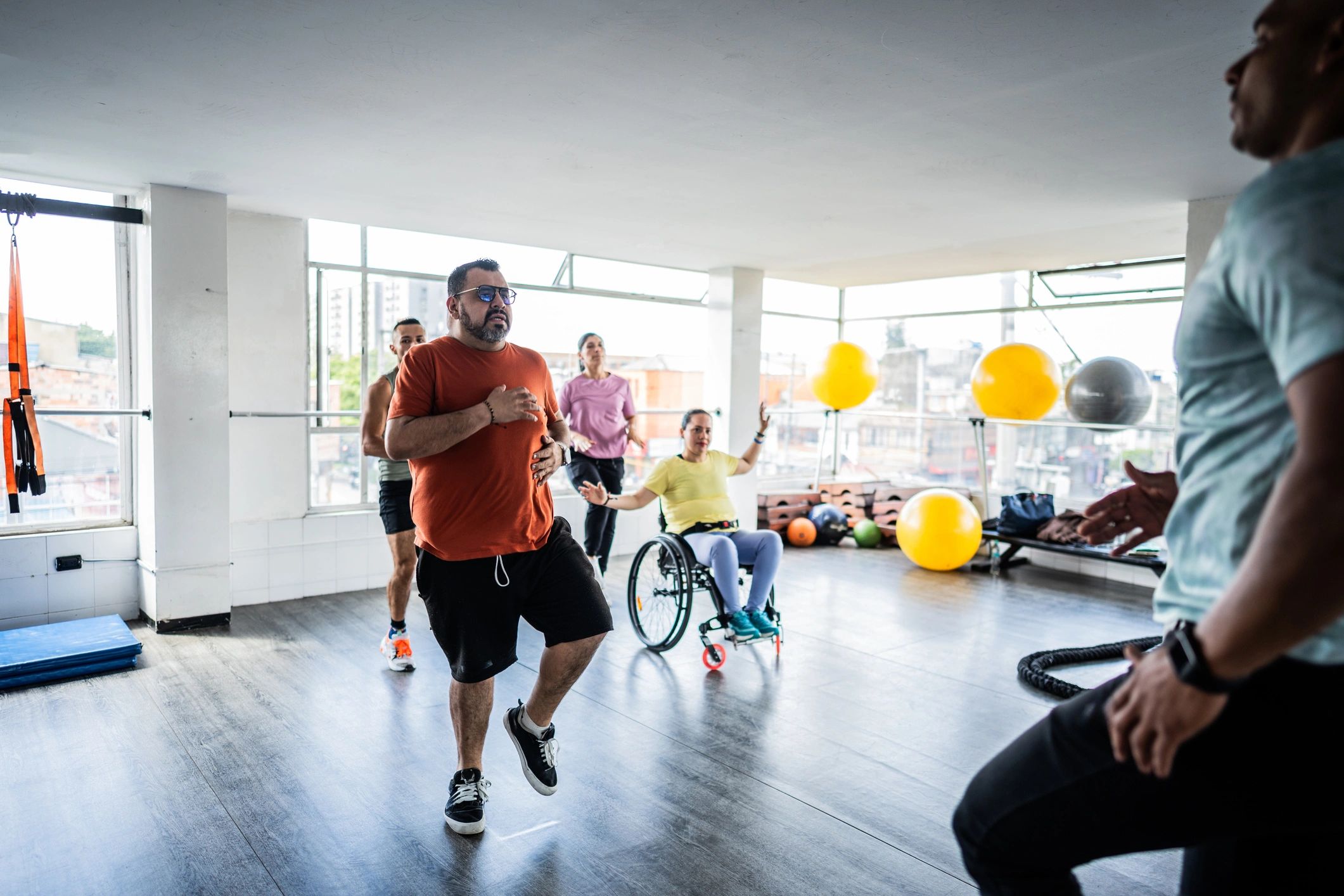 People doing aerobic exercises in a gym