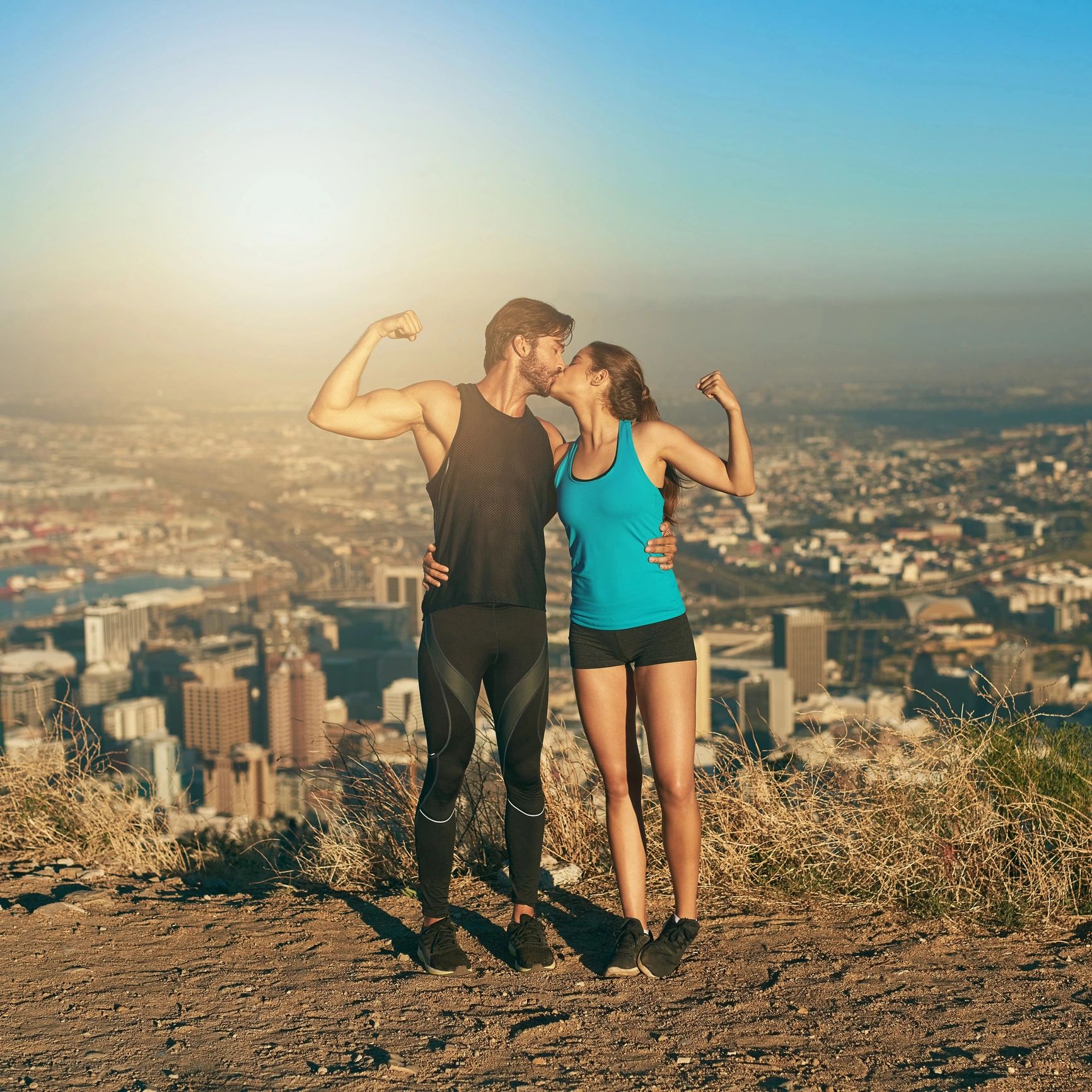 Two gym members posing after a workout
